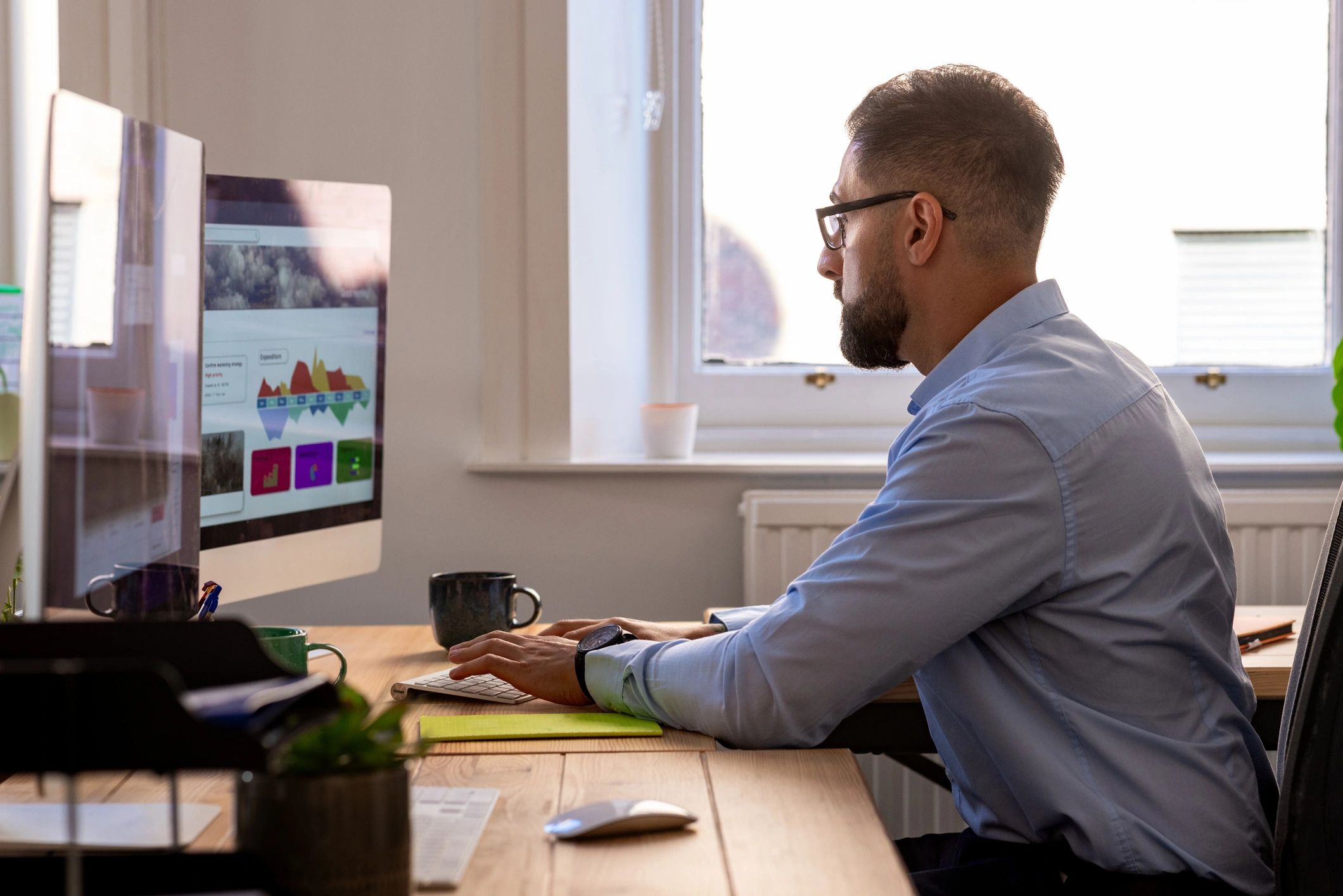 Photo editor working carefully at a desk